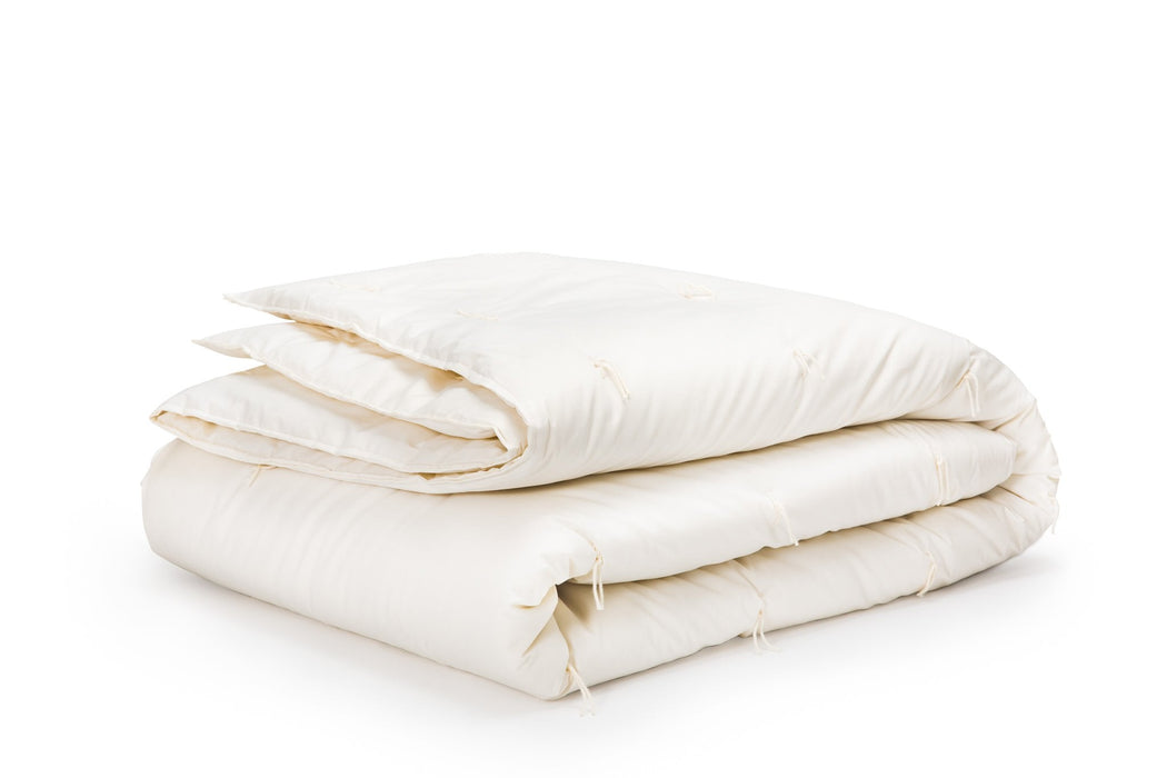 Wool comforter on white background