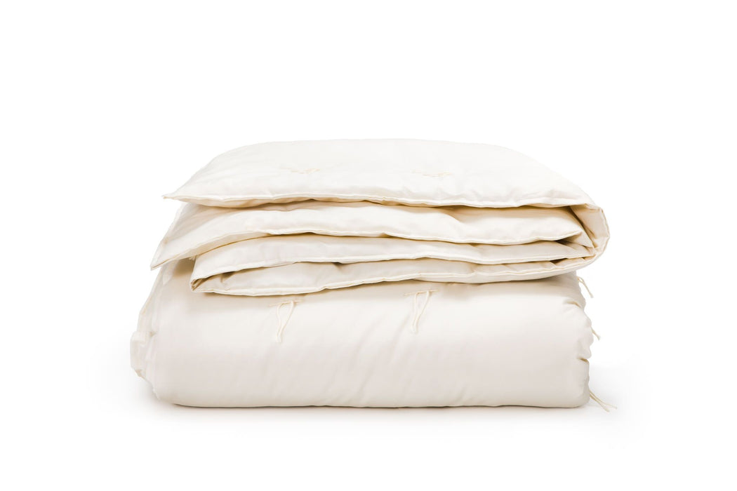 Wool comforter on white background